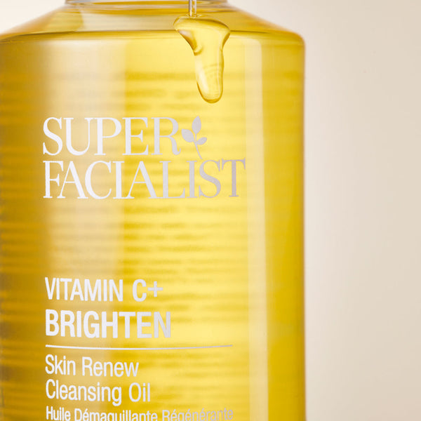 Vitamin C cleansing oil close up pack shot with dripping oil